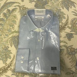 Mens Calvin Klein long sleeve button up. Brand new, never opened.